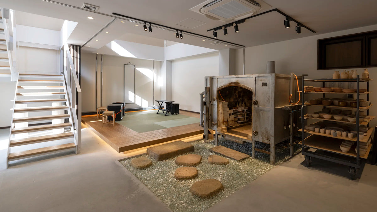The stairway down into the studio, with the raku kiln and tsuboniwa garden beyond